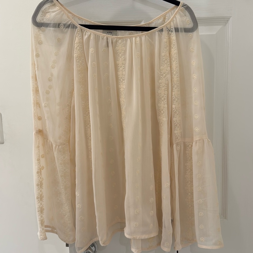 Beautiful.  Brand new.  Feminine. Wide sleeves